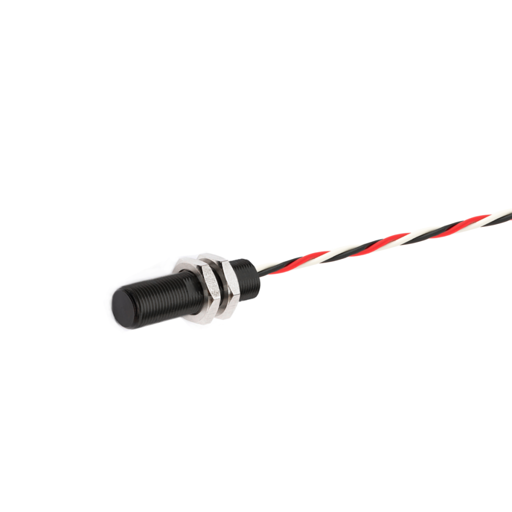 A cylindrical black AH Series Analog Hall Sensor with two hexagonal metal nuts, attached to a twisted red, black, and white wire, isolated on a white background. by Standex Detect