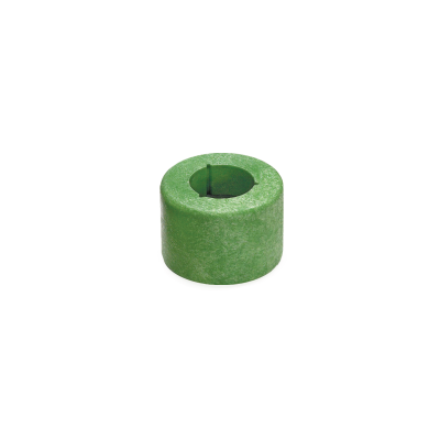 A small, cylindrical green object with a hollow center and a narrow slit on one side, resembling a foam or rubber spacer or bushing, often used as a component in Magnetic Floats, shown on a white background. by Standex Detect