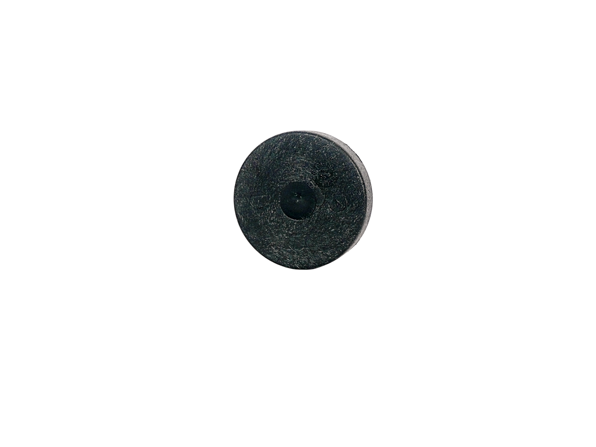 A single round black hockey puck from the MS06-PP Series is centered on a plain white background. by Standex Detect