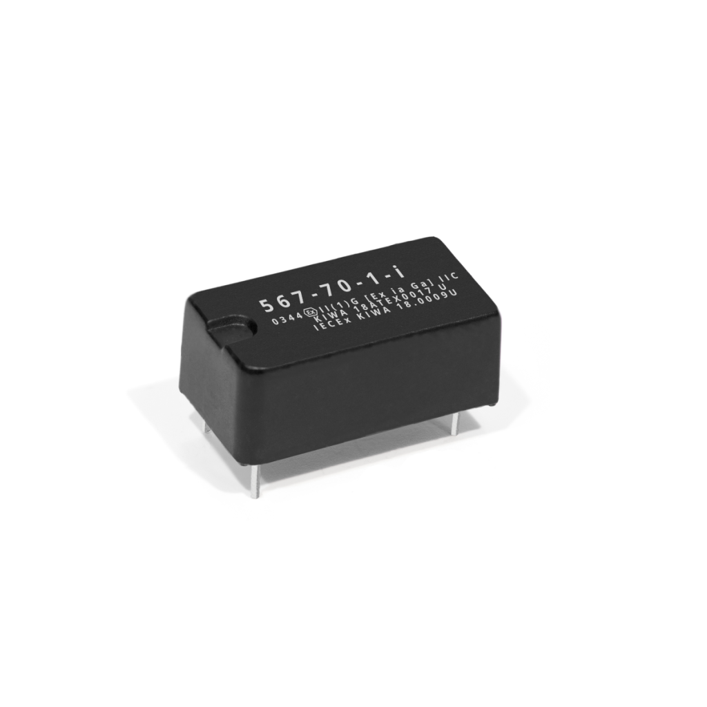A small black electronic component with four metal pins and white alphanumeric markings on top, this device resembles common optocouplers, placed on a white background. by Standex Detect