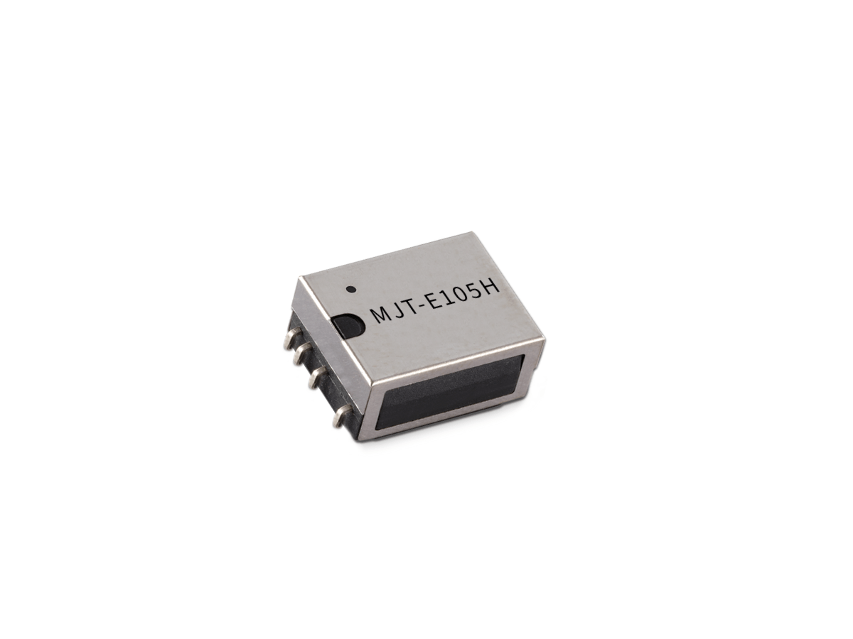 A small rectangular MT Series Reed Relay electronic component with five metal pins and the label “MJT-E105H” printed on the top, isolated on a white background. by Standex Detect