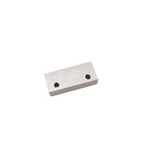 A rectangular metal block with two round holes drilled through the top surface, featuring the robust M27 Series Magnet, placed on a white background. by Standex Detect