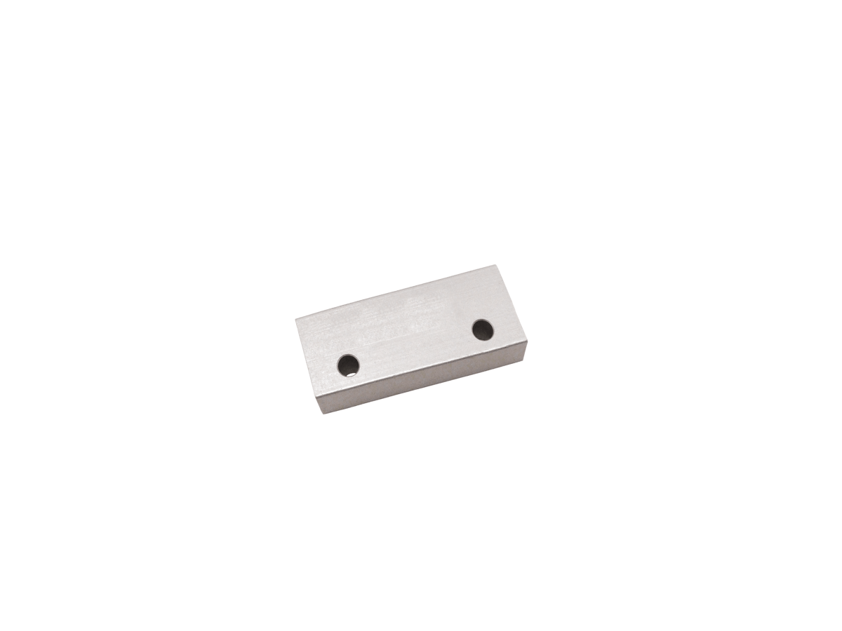 A rectangular M27 Series Magnet metal block with two circular holes on its top surface, set against a plain white background. by Standex Detect
